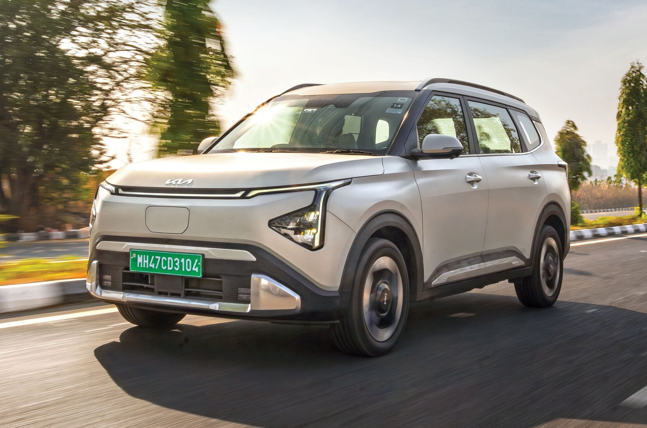 Kia Carens Clavis EV front left side driving on road